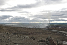 smoking smelter in devastated landscape